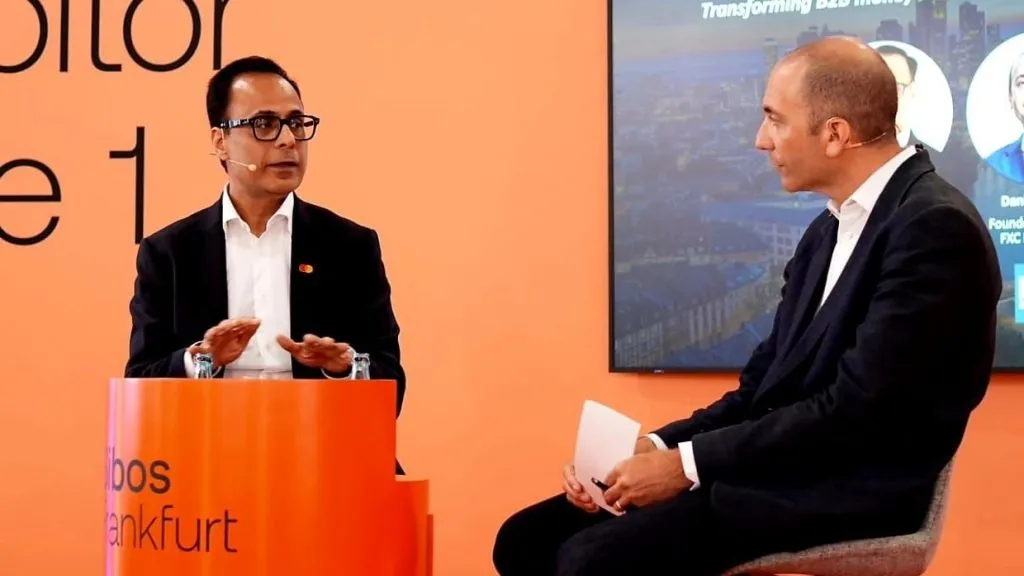 A photo of Pratik Khowala, Executive Vice President and Global Head of Transfer Solutions at Mastercard and Daniel Webber, CEO of FXC Intelligence, in conversation at Sibos 2025