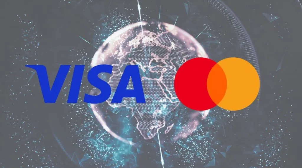 A graphic showing Visa and Mastercard's logo overlaid on a visualisation of the globe